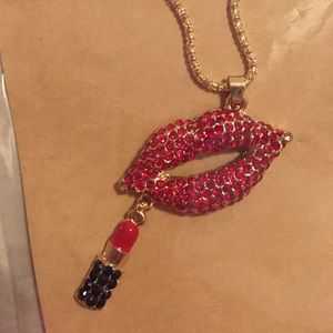 Betsy Johnson Big Red Lips Putting on Lipstick Necklace.
